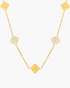 Gold necklace with floral pendants on a white background